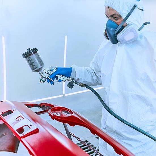 man painting car part — Paint Spraying Equipment & Booths in Fontana, CA man painting car part — Paint Spraying Equipment & Booths in Fontana, CA